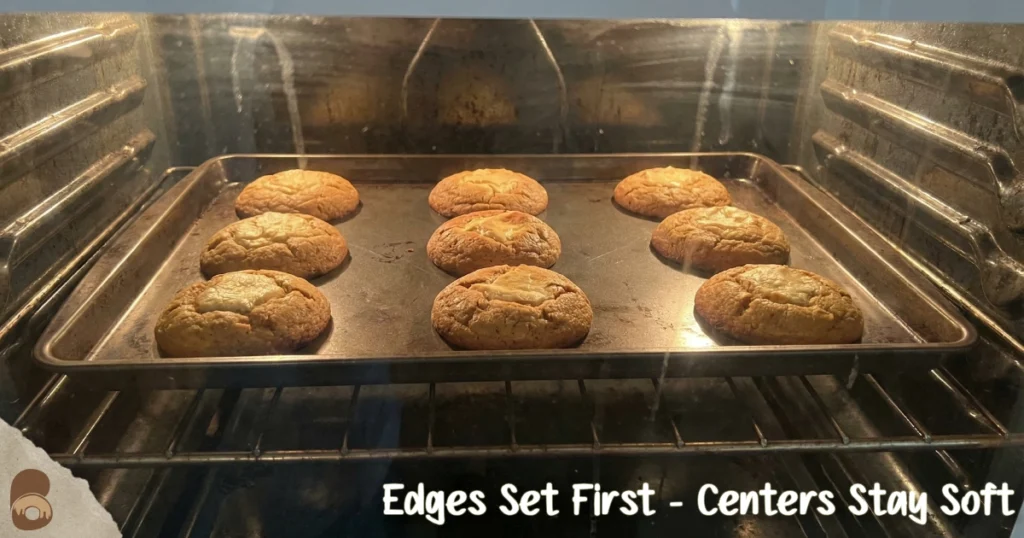 Pumpkin cheesecake cookies baking in oven, edges golden, centers pale and thick.